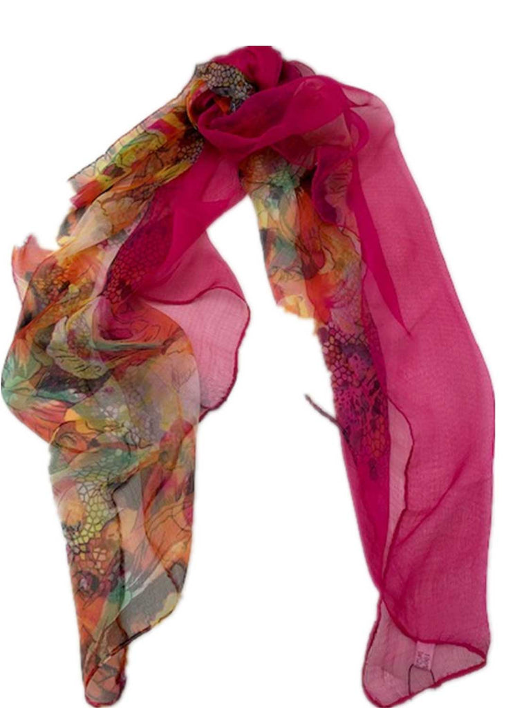 Pink and and multi coloured scarf styled into a loop.