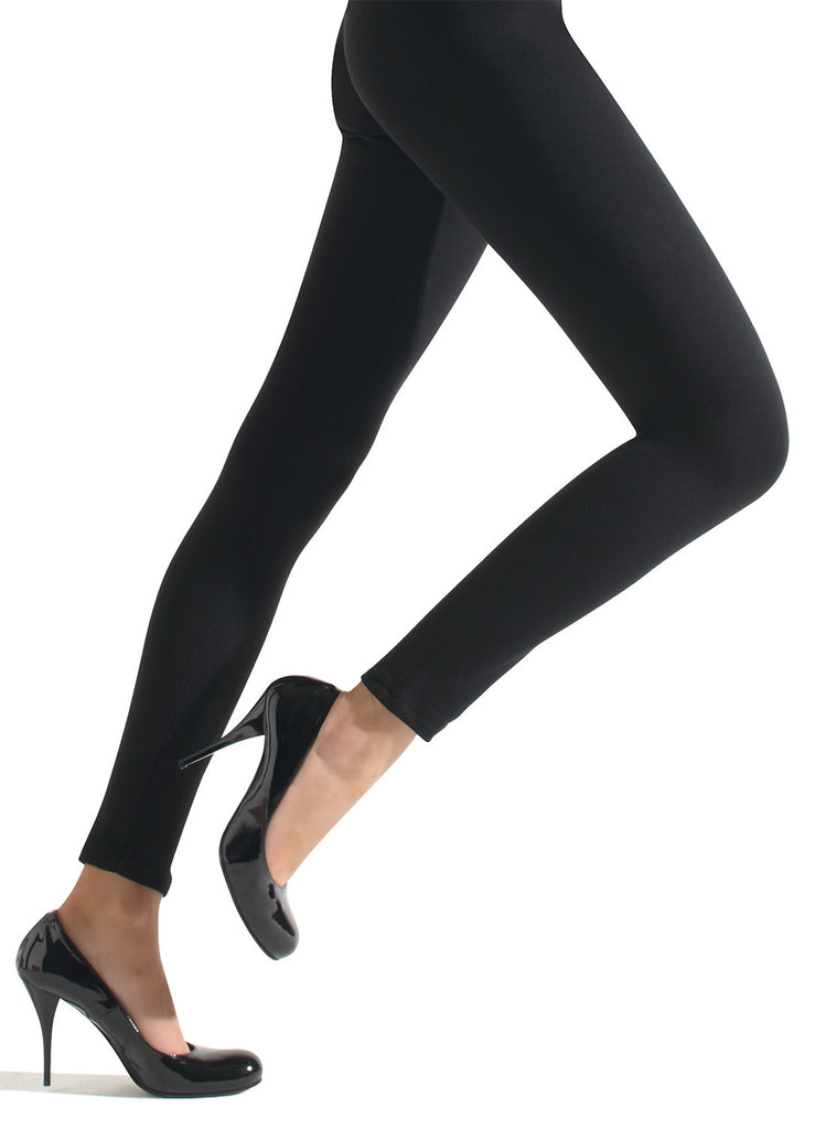 Side view of ladies legs in black leggings and heels.