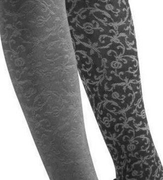 Close up of lady's legs in black and grey flower pattern tights..