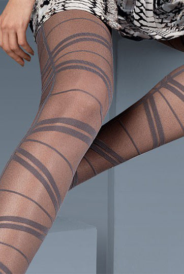 Close up of lady's upper and lower legs wearing Oroblu Sarah geometric pattern tights.