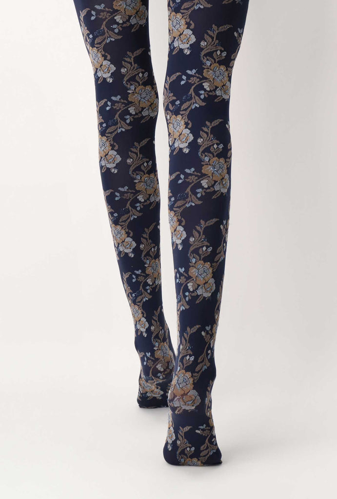Back view of lady's legs walking in blue floral tights.