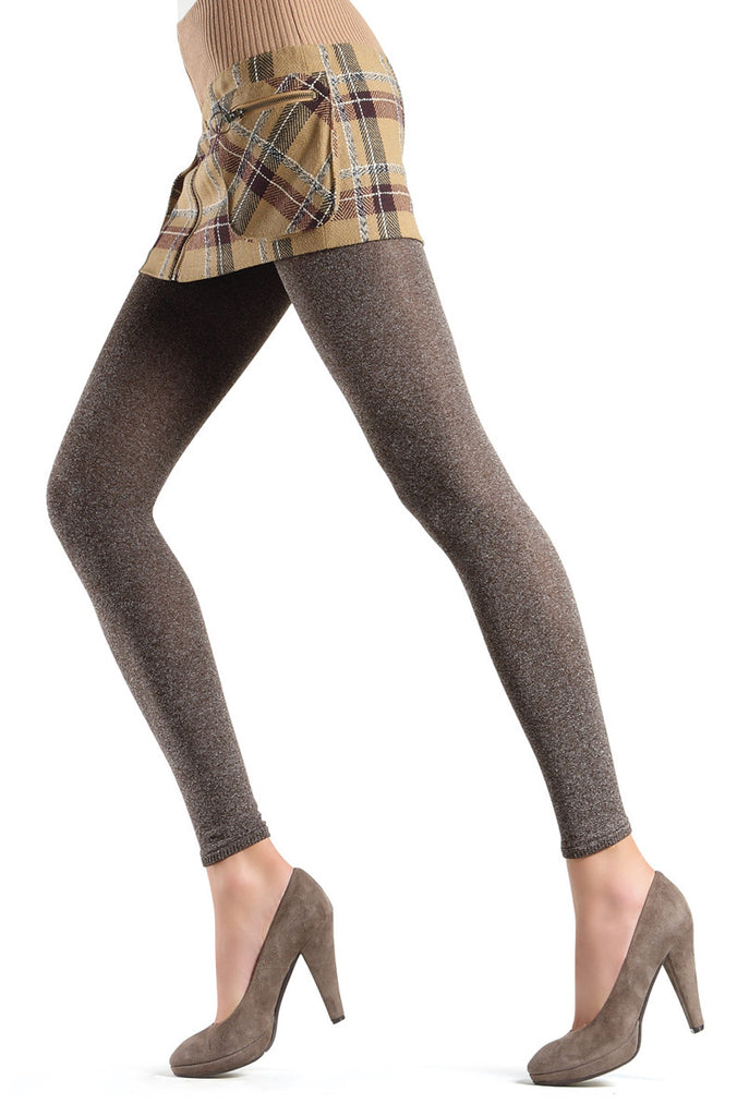 Lady's legs in taupe footless tights and brown heels.