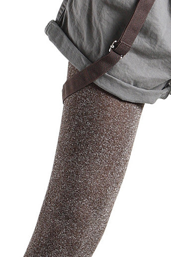 Close up of lady's upper leg, wearing bronze tights.