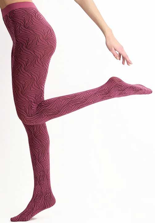 Lady's leg outstretched kicking back and wearing pink floral tights.