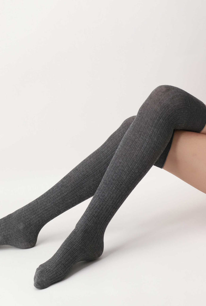 Lady's legs, crossed at the knee, in long, grey, over the knee socks.