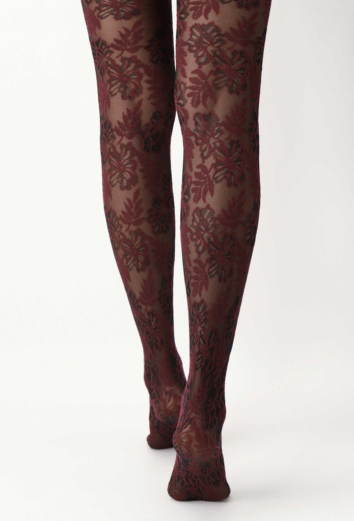 Back view of lady's lower legs in black and bordeaux red floral lace tights.