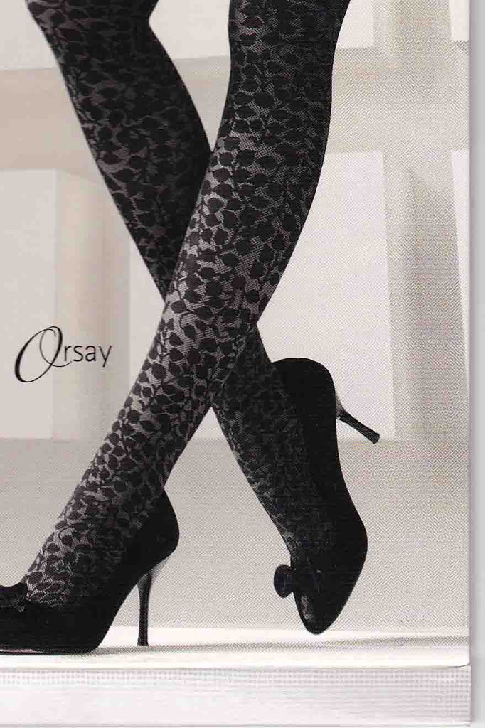 Close up of lower half of a lady's legs wearing floral pattern tights and black heels.