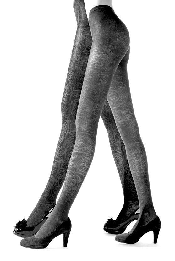 Side view of two ladies legs walking, wearing dark grey  pattern tights.