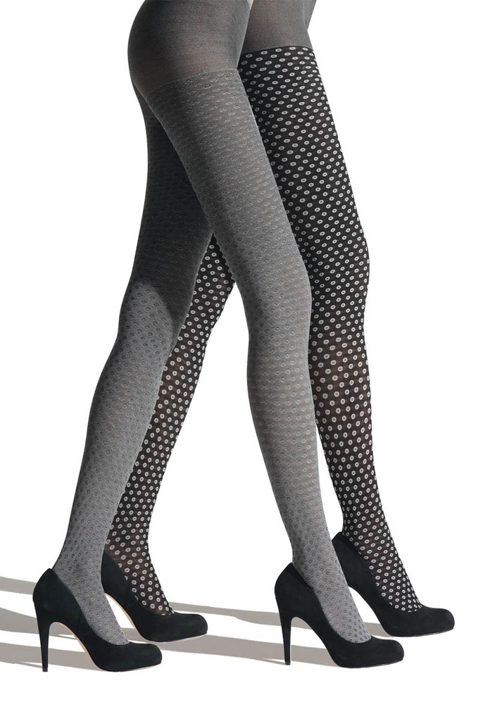 Side view of lady's legs in walking mode, wearing black and grey dot tights.