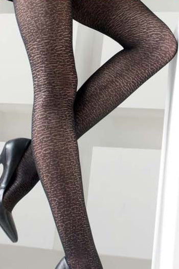 Close up of lady's legs showing black reptile patterned tights.