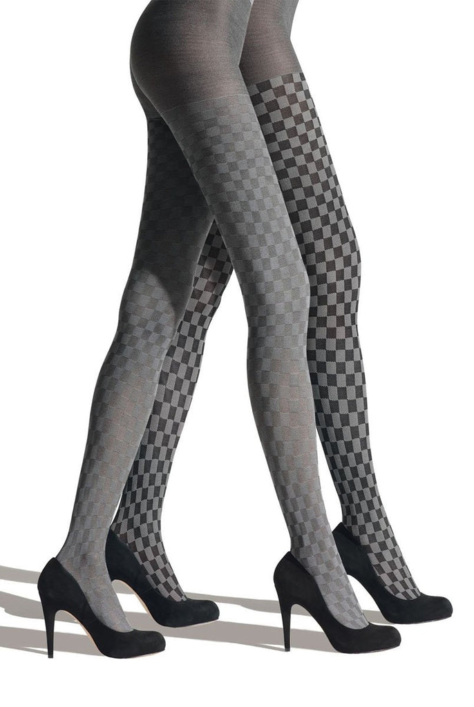 Side view of lady's legs walking in black and grey check tights.